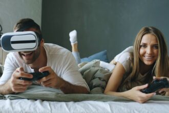 Couple playing video games with vr headset
