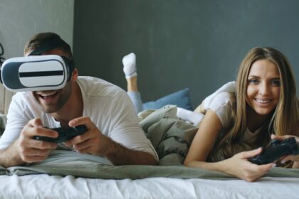 Couple playing video games with vr headset