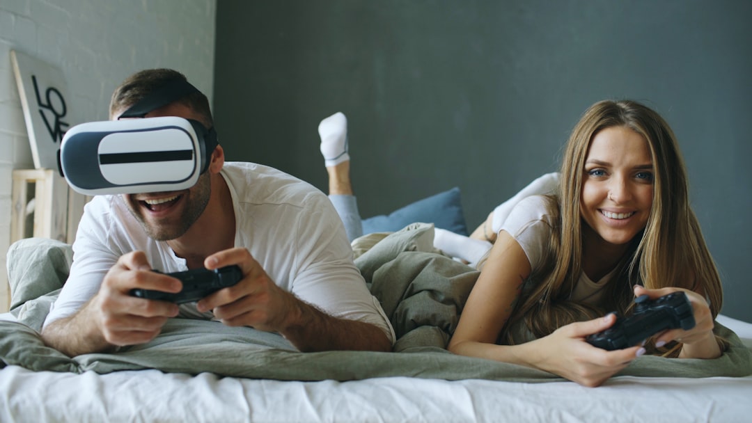 Couple playing video games with vr headset
