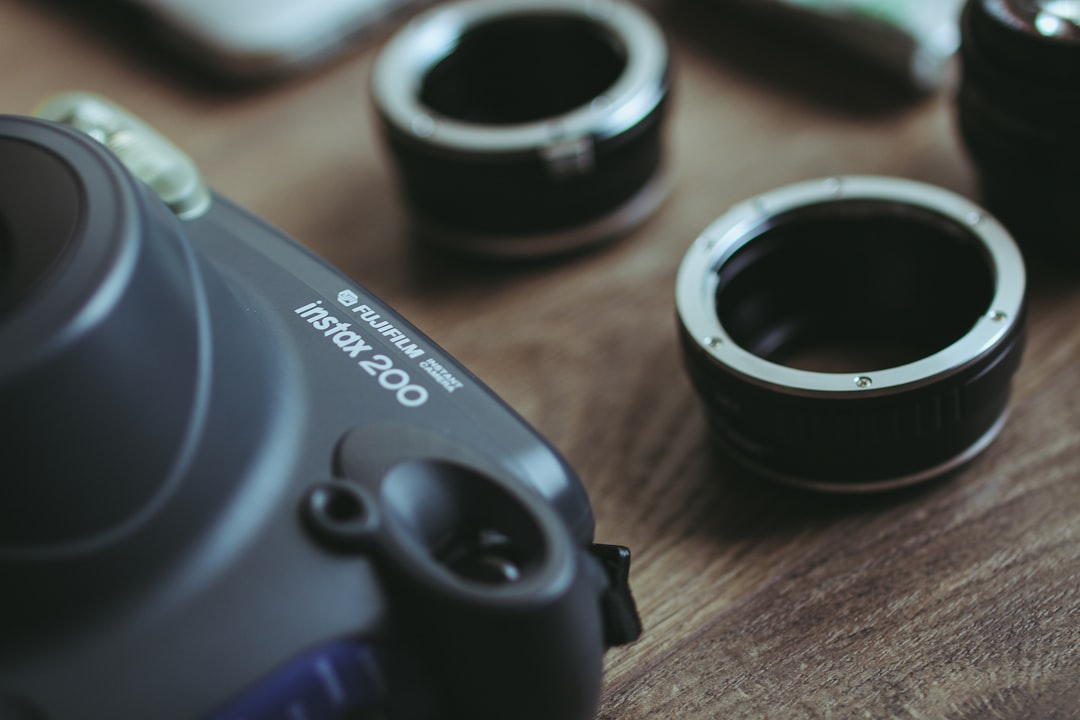 A camera sitting on top of a wooden table